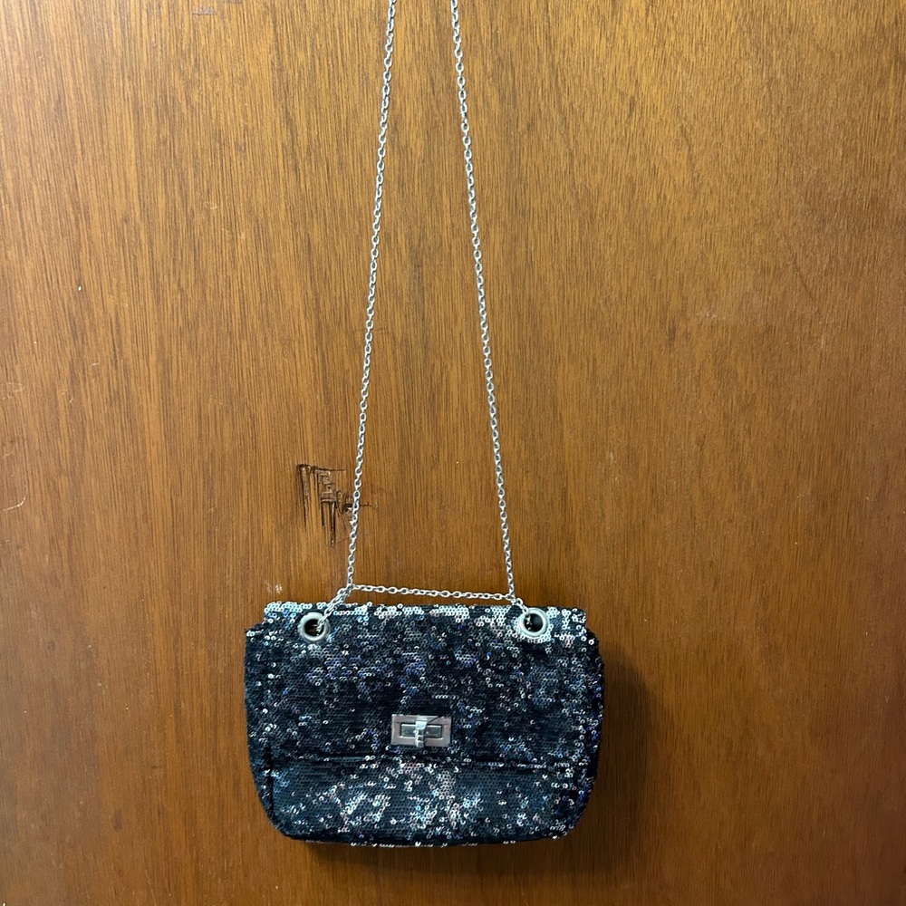 Black Clutch with Silver Chain Strap with matching gym shoes